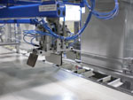 Výroba hygienických potřeb - ruka ramene robota / Foto 1